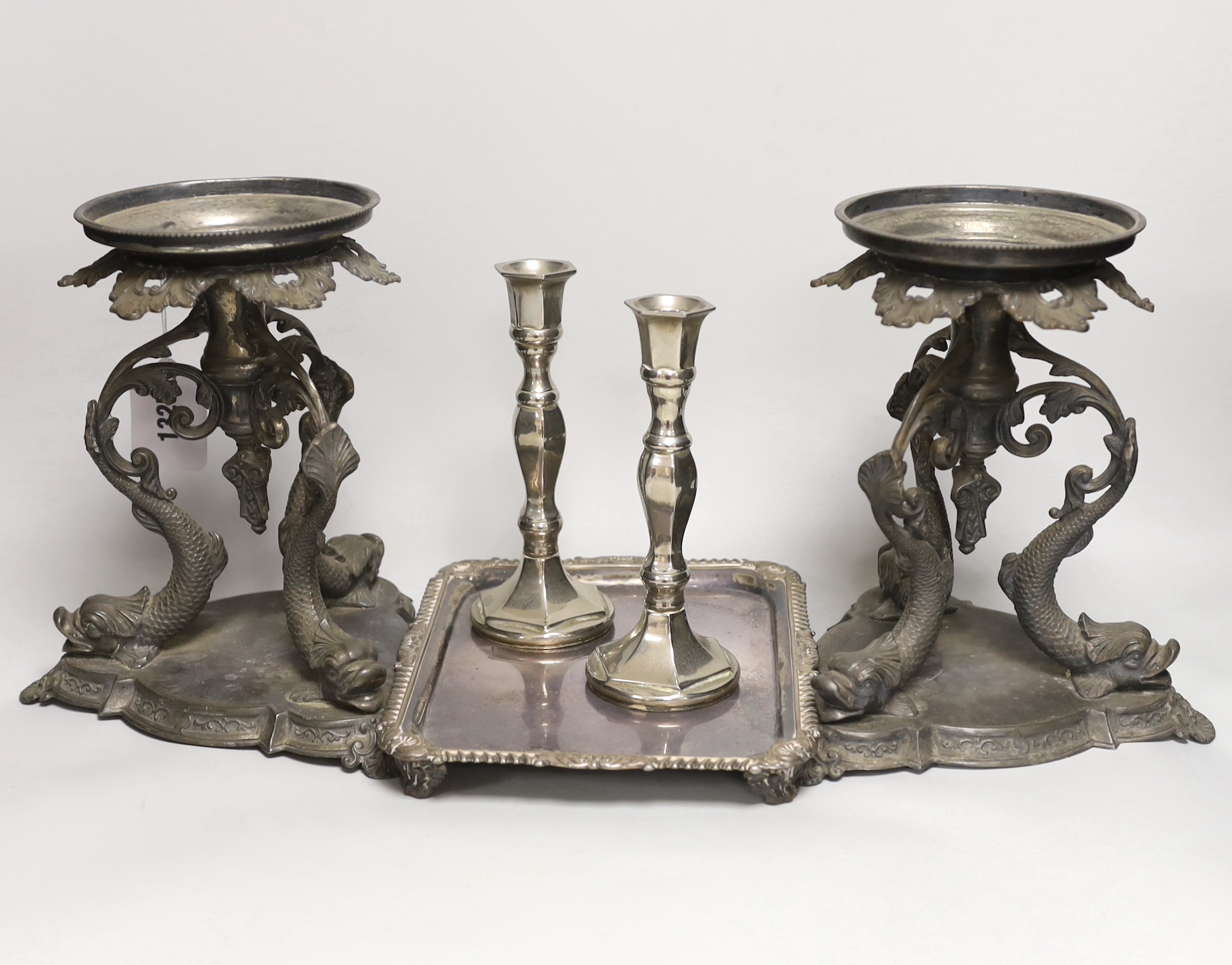 A pair of silver plated Philip Ashberry & Sons dolphin tazza’s, impressed 656 to the bases, together with a tray and pair of candlesticks, the largest each 23cm high